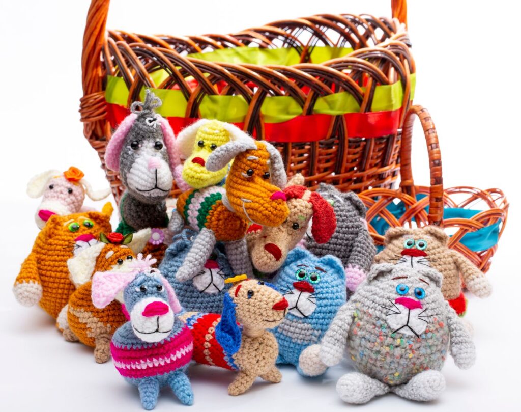 Adorable handmade crochet animal toys displayed with a festive basket, perfect for gift-giving occasions.